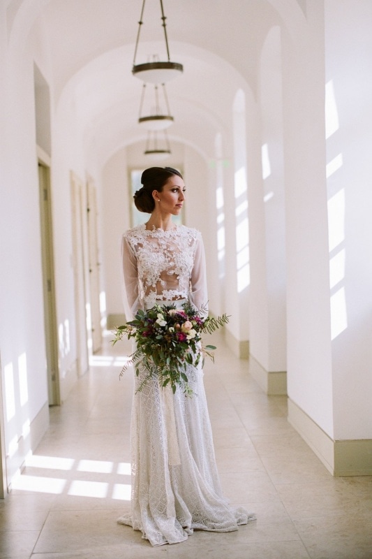 bride wearing a two-piece lace dress with see-through bodice