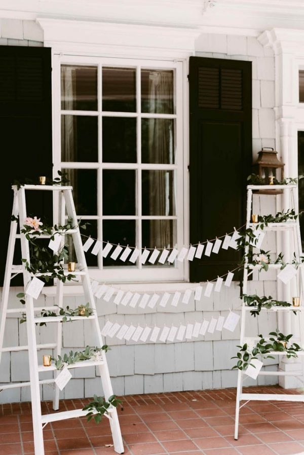 DIY Escort Card Station with Ladders and Greenery