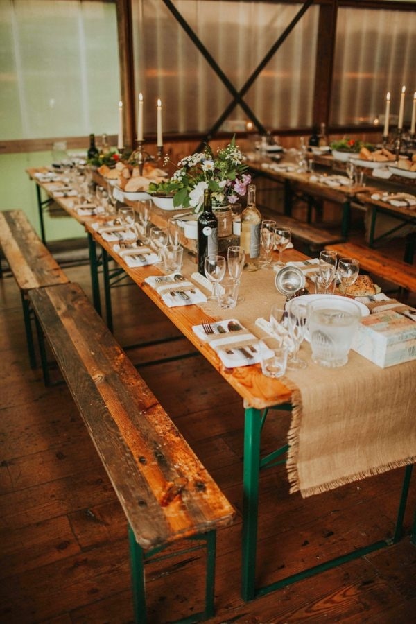 Rustic and Laid Back Barn Reception with Picnic Tables, Burlap Runners, and Wildflowers
