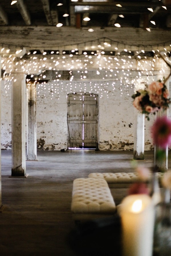 Barn Reception with Lots of Twinkle Lights, Lounge Seating, and Pink Florals