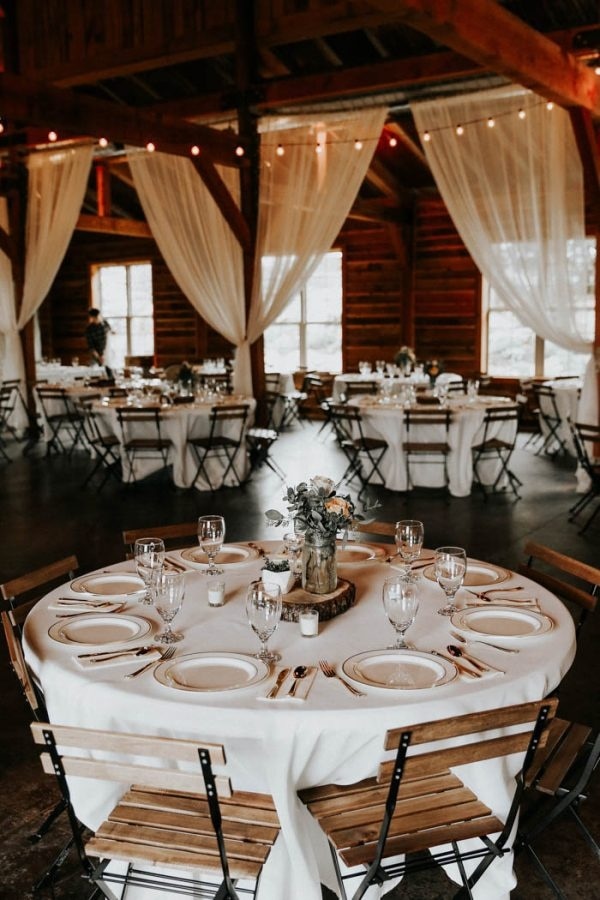 White Table Cloths and White Curtain Barn Reception Decor