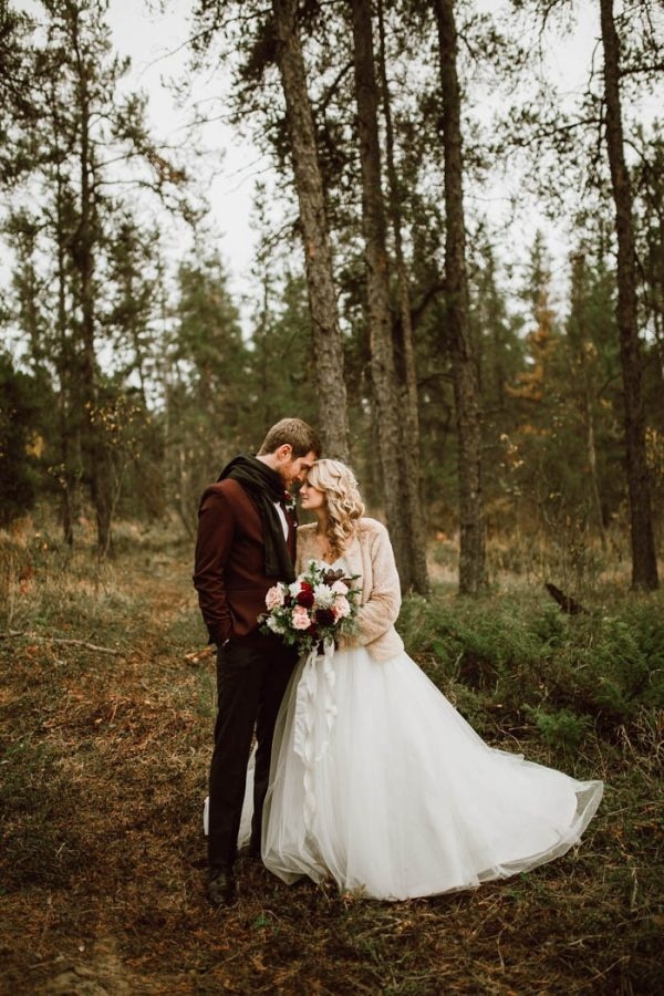 Winter Wedding Style Inspiration: Groom in a Marsala Colored Jacket and Black Scarf and Bride with a Champagne Colored Jacket
