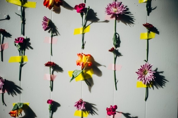Quirky DIY Wedding Flowers Taped to Wall