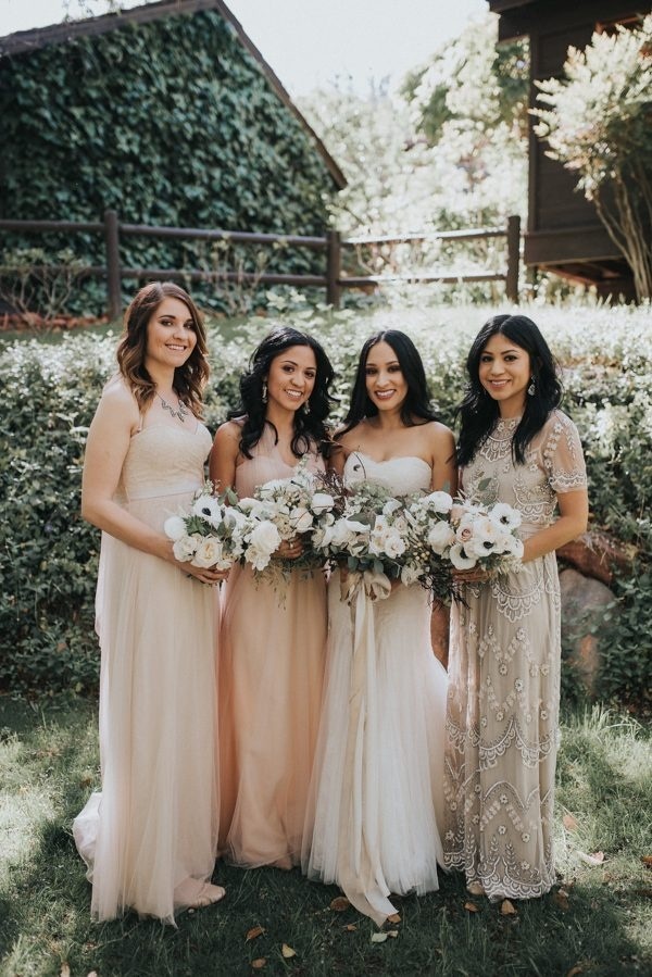 Mismatched Bridesmaid Dresses in Shades of Pink, Ivory, and Champagne