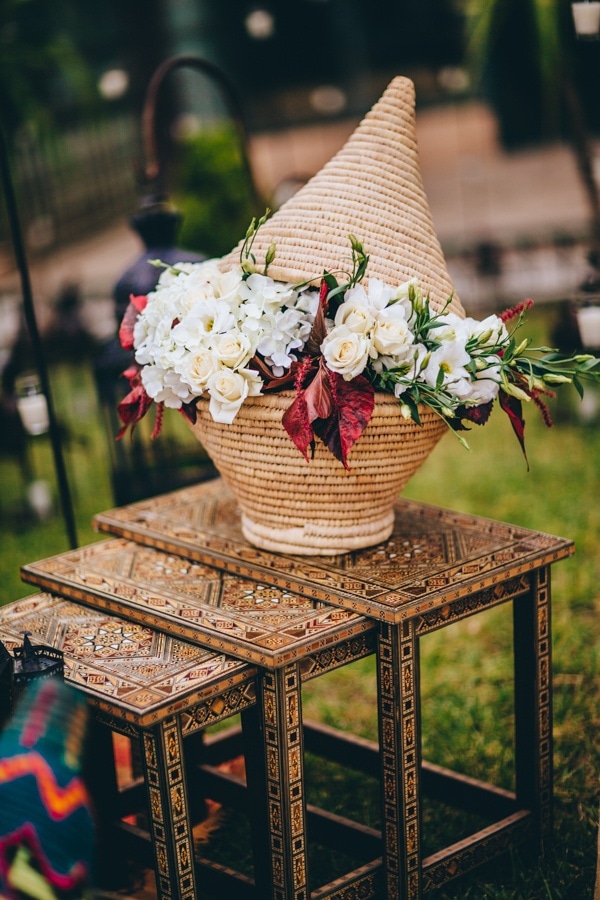 Moroccan Floral Display with Rattan Vase and Rose Floral Design