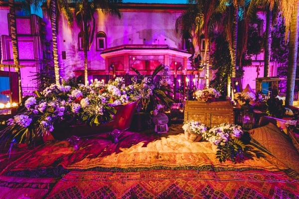 Elegant Moroccan-Inspired Wedding Reception Area with Uplighting