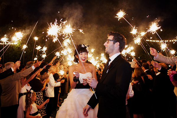 happy bride and groom aglow with the lights of sparklers - Gorgeous wedding reception photo by LA-based Apertura | Junebug Weddings happy bride and groom aglow with the lights of sparklers - Gorgeous wedding reception photo by LA-based Apertura | Junebug Weddings