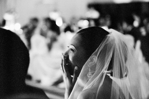 delighted bride laughs with joy at reception - Lovely wedding reception photo by Austin-based Q Weddings | Junebug Weddings delighted bride laughs with joy at reception - Lovely wedding reception photo by Austin-based Q Weddings | Junebug Weddings