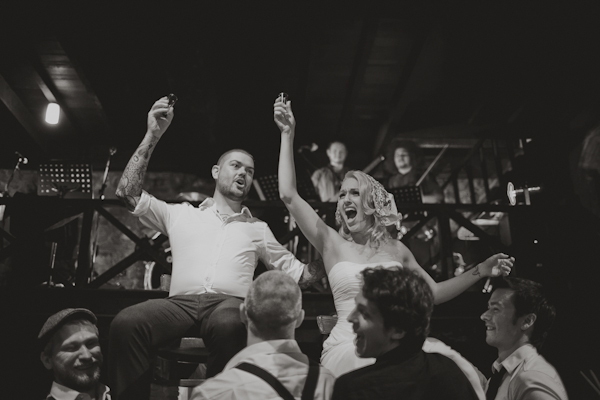 happy bride and groom raise shots with friends - Distinctive wedding reception photo by Australia-based Darin Collison | Junebug Weddings happy bride and groom raise shots with friends - Distinctive wedding reception photo by Australia-based Darin Collison | Junebug Weddings