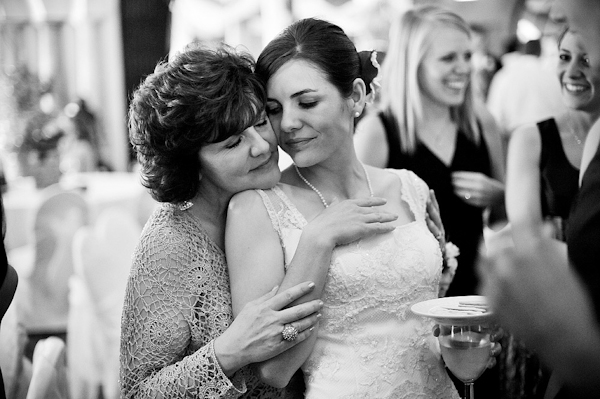sweet moment as mother hugs bride - Emotional wedding reception photo by Houston-based Philip Thomas | Junebug Weddings sweet moment as mother hugs bride - Emotional wedding reception photo by Houston-based Philip Thomas | Junebug Weddings