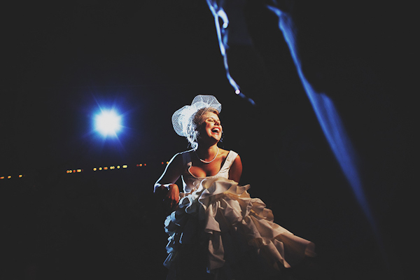 stunning and happy bride illuminated by blue moonlight - Stunning wedding reception photo by San Francisco-based Erik Clausen | Junebug Weddings stunning and happy bride illuminated by blue moonlight - Stunning wedding reception photo by San Francisco-based Erik Clausen | Junebug Weddings
