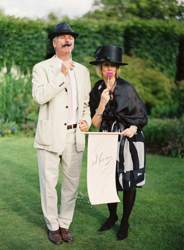 hilarious wedding reception photo of couple with silly photo booth props - hilarious wedding photo by top UK based wedding photographer Aneta MAK Photography hilarious wedding reception photo of couple with silly photo booth props - hilarious wedding photo by top UK based wedding photographer Aneta MAK Photography
