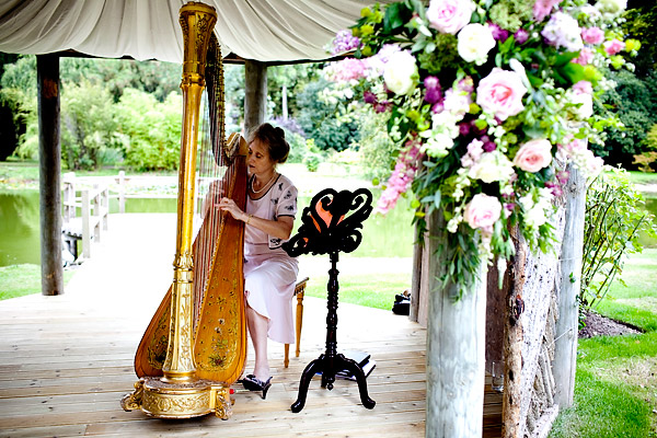 The musician playing the harp- Jane Austen inspired UK wedding in Chippenham Park - photos by top North Carolina wedding photographer Tracy Turpen Jane Austen inspired UK wedding in Chippenham Park - photos by top North Carolina wedding photographer Tracy Turpen