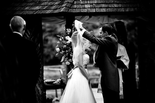 The groom lifts the bride’s veil- Jane Austen inspired UK wedding in Chippenham Park - photos by top North Carolina wedding photographer Tracy Turpen Jane Austen inspired UK wedding in Chippenham Park - photos by top North Carolina wedding photographer Tracy Turpen