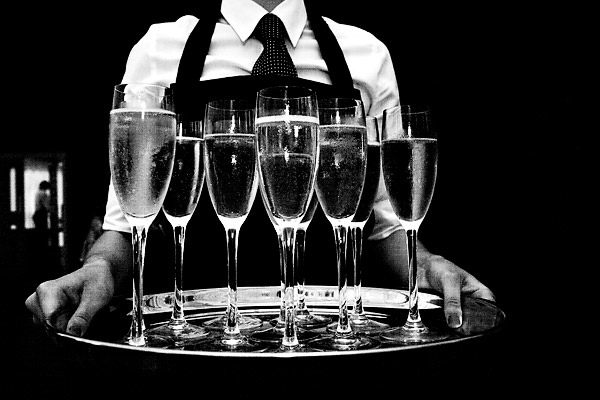 The server carrying a tray of champagne- Jane Austen inspired UK wedding in Chippenham Park - photos by top North Carolina wedding photographer Tracy Turpen Jane Austen inspired UK wedding in Chippenham Park - photos by top North Carolina wedding photographer Tracy Turpen