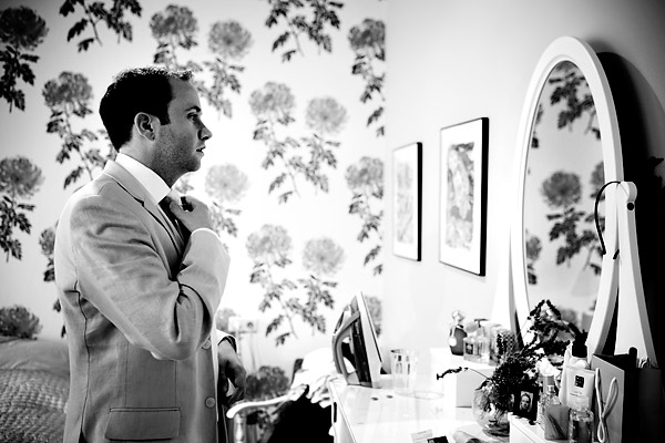 The groom fixing his tie in the mirror as he gets ready- Amsterdam trolley wedding on Electrische Museumtram - photos by top North Carolina wedding photographer Tracy Turpen Amsterdam trolley wedding on Electrische Museumtram - photos by top North Carolina wedding photographer Tracy Turpen