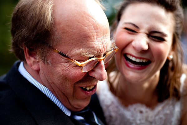 The bride and guest laughing- Amsterdam trolley wedding on Electrische Museumtram - photos by top North Carolina wedding photographer Tracy Turpen Amsterdam trolley wedding on Electrische Museumtram - photos by top North Carolina wedding photographer Tracy Turpen