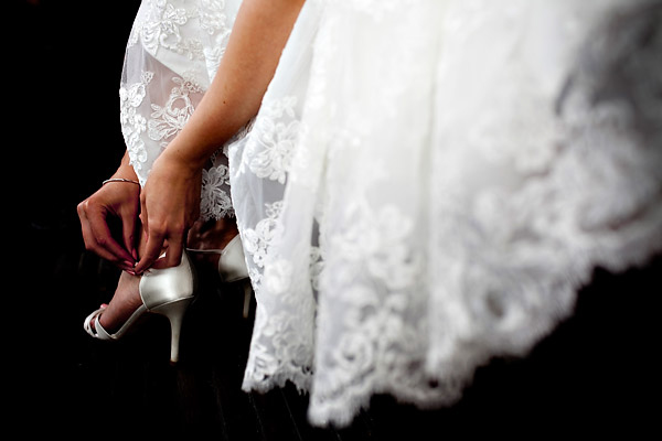 The bride buckling the strap on her shoe as she gets ready- Amsterdam trolley wedding on Electrische Museumtram - photos by top North Carolina wedding photographer Tracy Turpen Amsterdam trolley wedding on Electrische Museumtram - photos by top North Carolina wedding photographer Tracy Turpen