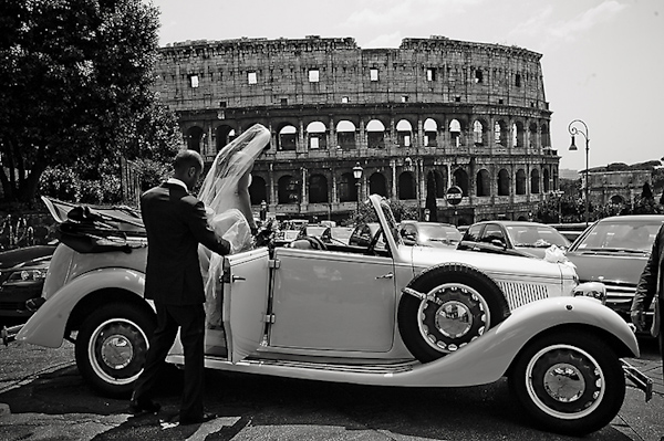 bride and groom getting into vintage convertible in front of Roman coliseum - photo by Rochelle Cheever of Rome Weddings Photography bride and groom getting into vintage convertible in front of Roman coliseum - photo by Rochelle Cheever of Rome Weddings Photography