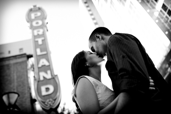 black and white photo of the happy couple kissing under Portland sign - engagement photo by top Portland, Oregon photographer Daniel Stark black and white photo of the happy couple kissing under Portland sign - engagement photo by top Portland, Oregon photographer Daniel Stark