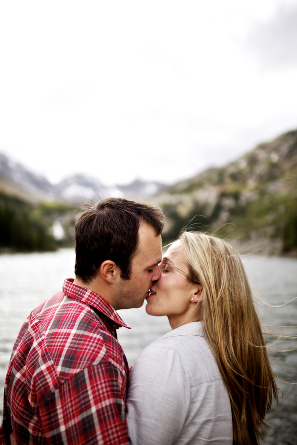 Couple kiss in front of the beautiful scenery- Breckenridge, Colorado engagement session in the snow, photos by Jason + Gina Wedding Photographers Breckenridge, Colorado engagement session in the snow, photos by Jason + Gina Wedding Photographers