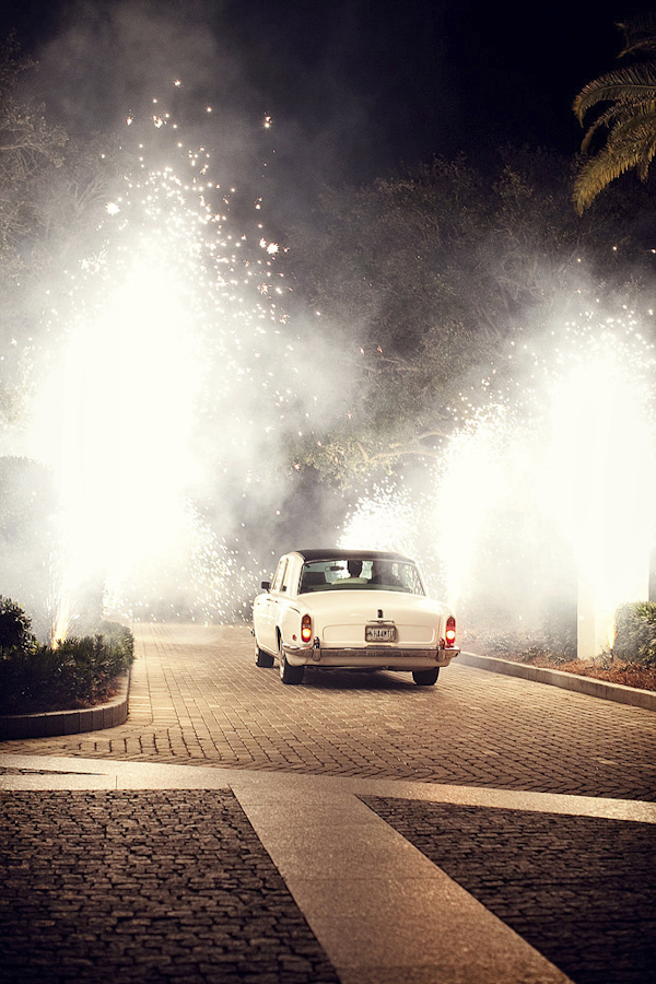 beautiful photo of couple riding away in car during grand firework wedding exit - photo by top Florida based photographers La Dolce Vita Studio beautiful photo of couple riding away in car during grand firework wedding exit - photo by top Florida based photographers La Dolce Vita Studio