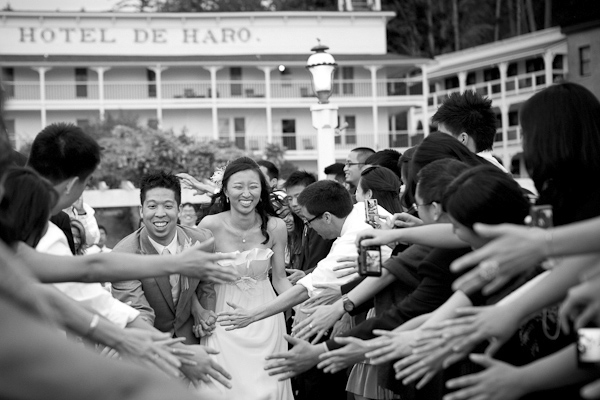 the happy couple laughing during grand wedding exit at Roche Harbor, WA - photo by top Seattle based photographers La Vie Photography the happy couple laughing during grand wedding exit at Roche Harbor, WA - photo by top Seattle based photographers La Vie Photography