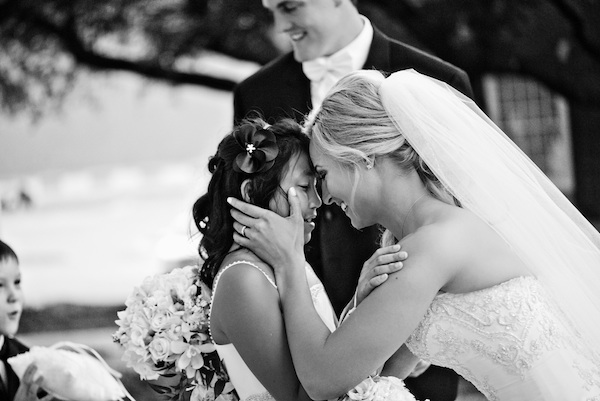 heartbreaking wedding photo of bride and flower girl by Dallas wedding photographers Aves Photographic Design heartbreaking wedding photo of bride and flower girl by Dallas wedding photographers Aves Photographic Design