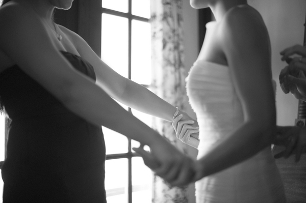 A bridesmaid admiring the bride in her dress- New England wedding - Bar Harbor Sorrento, Maine - photos by top east coast wedding photographers Justin and Mary New England wedding - Bar Harbor Sorrento, Maine - photos by top east coast wedding photographers Justin and Mary