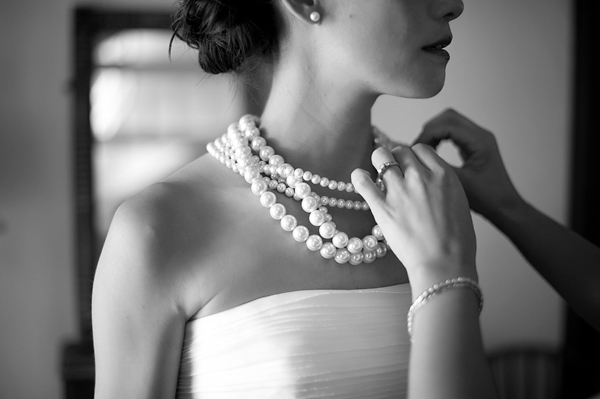 The bride getting help with her necklace- New England wedding - Bar Harbor Sorrento, Maine - photos by top east coast wedding photographers Justin and Mary New England wedding - Bar Harbor Sorrento, Maine - photos by top east coast wedding photographers Justin and Mary