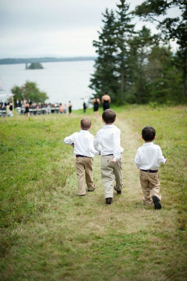 Kids run down the hill towards the ceremony- New England wedding - Bar Harbor Sorrento, Maine - photos by top east coast wedding photographers Justin and Mary New England wedding - Bar Harbor Sorrento, Maine - photos by top east coast wedding photographers Justin and Mary