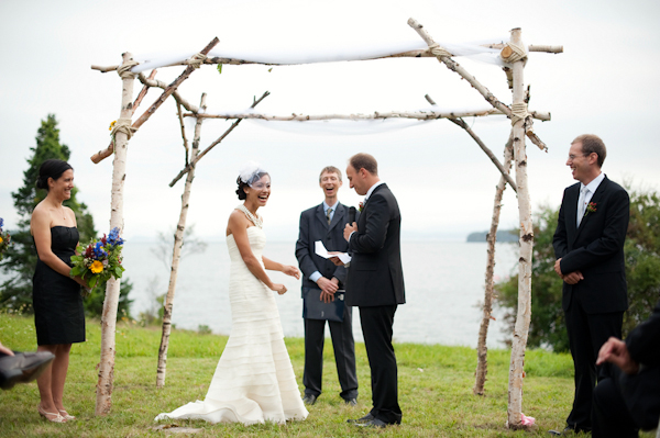 The bride and groom standing at the alter- New England wedding - Bar Harbor Sorrento, Maine - photos by top east coast wedding photographers Justin and Mary New England wedding - Bar Harbor Sorrento, Maine - photos by top east coast wedding photographers Justin and Mary