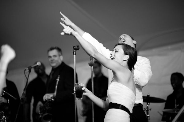 Bride and groom get on stage and have fun in front of their guests- New England wedding - Bar Harbor Sorrento, Maine - photos by top east coast wedding photographers Justin and Mary New England wedding - Bar Harbor Sorrento, Maine - photos by top east coast wedding photographers Justin and Mary