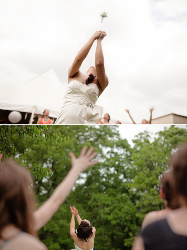 creative perspective of bride tossing bouquet - wedding photo by top Austin photography duo InTandem creative perspective of bride tossing bouquet - wedding photo by top Austin photography duo InTandem