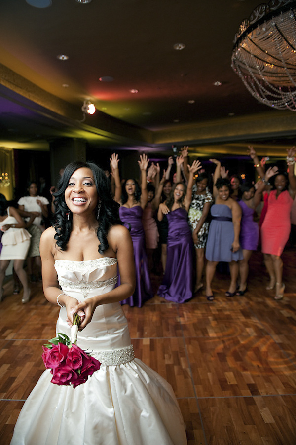 classic photo of bride getting ready to toss bouquet during reception - wedding photo by top Houston photographer Adam Nyholt classic photo of bride getting ready to toss bouquet during reception - wedding photo by top Houston photographer Adam Nyholt