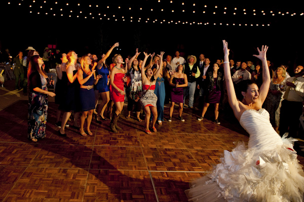 fun photo of bride tossing bouquet - wedding photo by top Houston wedding photographer Morgan Lynn fun photo of bride tossing bouquet - wedding photo by top Houston wedding photographer Morgan Lynn