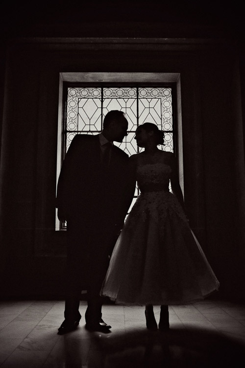Silhouette wedding portrait at San Francisco City Hall, photo by Paco and Betty