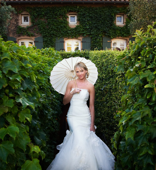 summer bride with a parasol - photo by Catherine Hall Studios | via junebugweddings.com