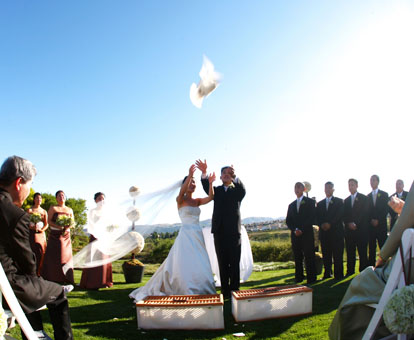 Releasing doves during an outdoor wedding ceremony, image by GH Kim Photography