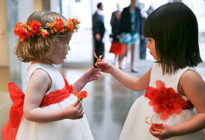 red, orange and white dressed flower girls, image by John and Joseph Photography
