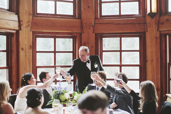 photo of guests toasting at intimate wedding reception, photo by Rowan Jane Photography | via junebugweddings.com