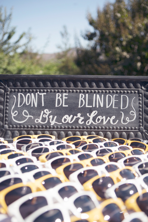 Wedding Photo by Christine Bentley Photography of sunglasses for outdoor wedding ceremony