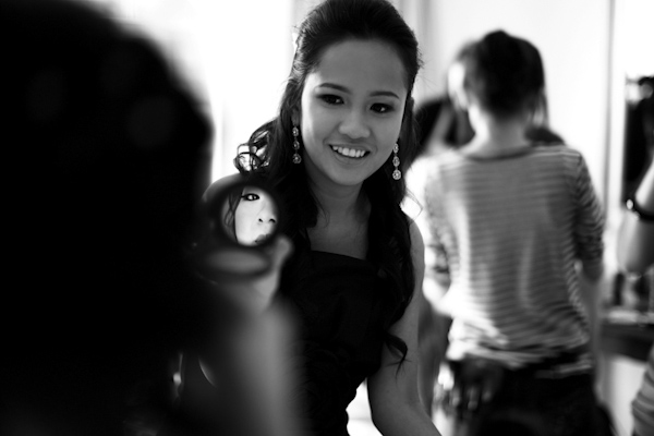 Reflection Of Bride In Hand Held Mirror Smiling Bridesmaid
