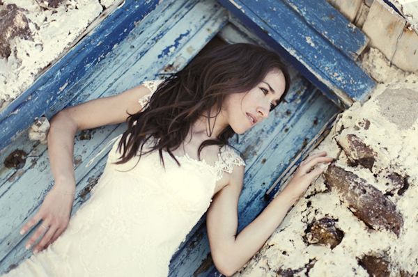 Bride Poses In The Doorway Of A Beautifuly Antique Building