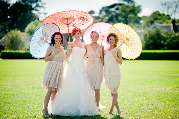 Wedding party with unique and colorful summer umbrellas - Wedding Photo by Elizabeth Davis