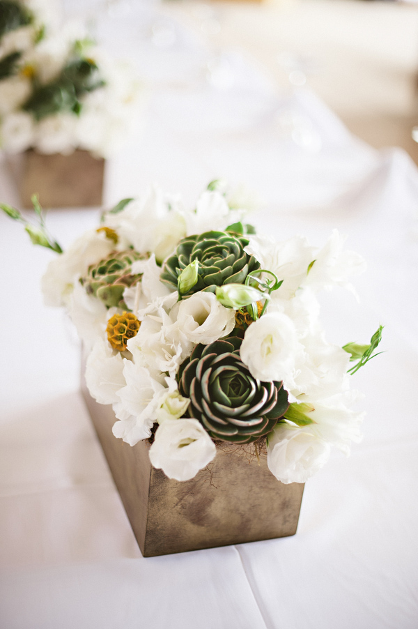 Pretty white, gray and sage green centerpiece in chrome vase - Photo by Jillian Mitchell