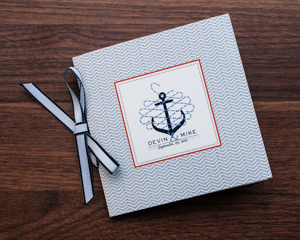 Nautical inspired, blue and orange guest book - Photo by Sarah Tew Photography