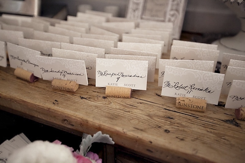 escort cards on wine corks at vineyard wedding at Sunstone Winery, photo by Ashleigh Taylor Photography