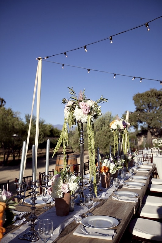 long table floral centerpieces at vineyard wedding at Sunstone Winery, photo by Ashleigh Taylor Photography