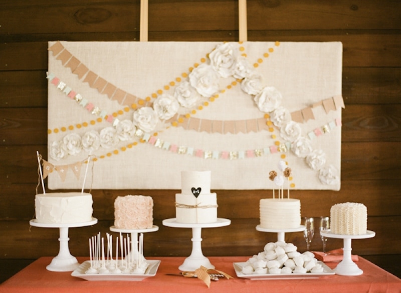 dessert table with cakes and paper flower garlands, photo by Taylor Lord Photography